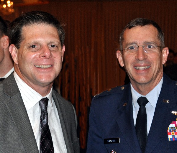Joe Pacileo, ManTech, speaks with Maj. Gen. Brett T. Williams, USAF, director of operations, J-3, U.S. Cyber Command, following the general’s speech at the March luncheon.